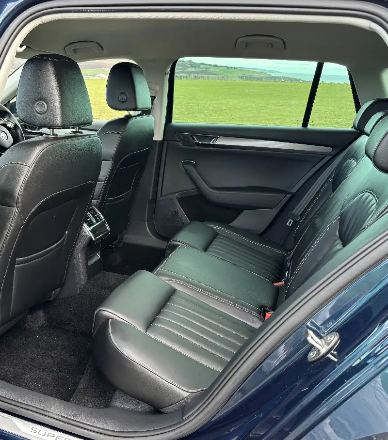 Rear seats of a Skoda Superb taxi taken from the open passengers side rear door