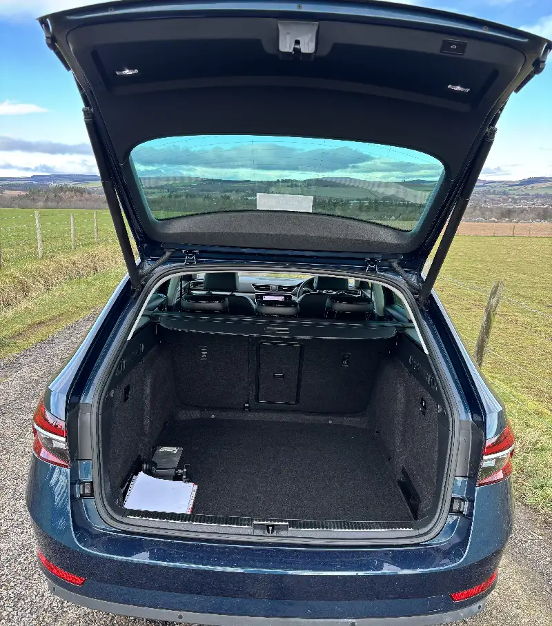 Open boot of a Skoda Superb estate car revealing the vast luggage area
